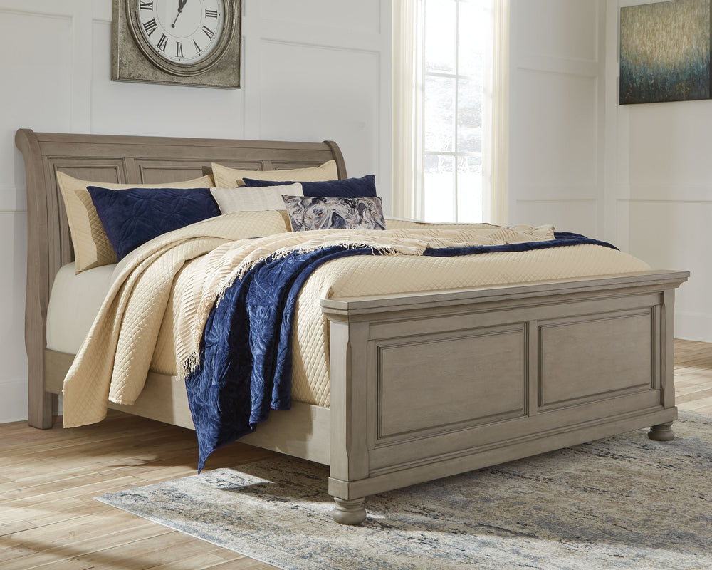 Satisfying your taste for tradition, this queen sleigh bed sports serene sophistication. Forever classic design details like inset panels and bun feet are so easy to love. A burnished light gray finish elevates the look with modern sensibility, so you can