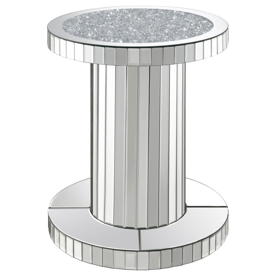 Luxurious elements come together to create a chic vibe in this modern glam accent table. The pedestal style keeps a simple contemporary silhouette that slides into the room effortlessly. Covered entirely in a reflective mirror tile, this accent table is e