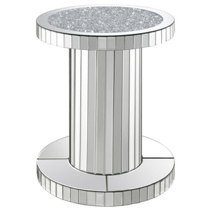 Luxurious elements come together to create a chic vibe in this modern glam accent table. The pedestal style keeps a simple contemporary silhouette that slides into the room effortlessly. Covered entirely in a reflective mirror tile, this accent table is e