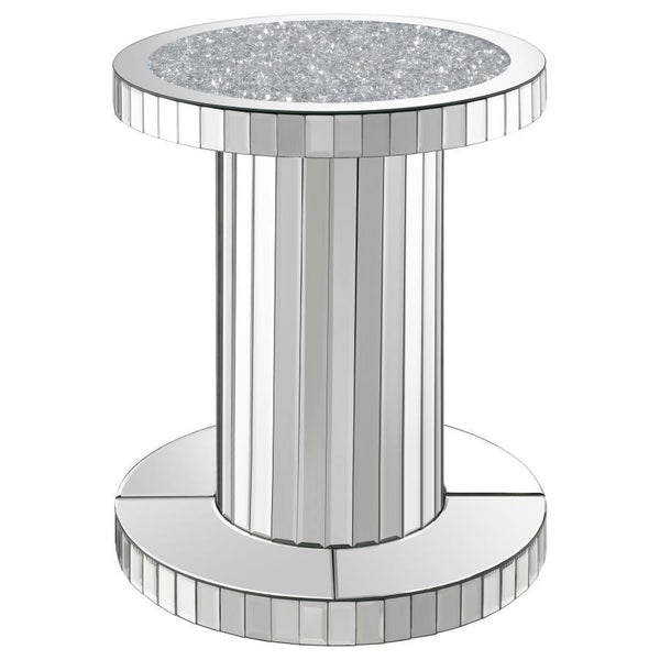Luxurious elements come together to create a chic vibe in this modern glam accent table. The pedestal style keeps a simple contemporary silhouette that slides into the room effortlessly. Covered entirely in a reflective mirror tile, this accent table is e