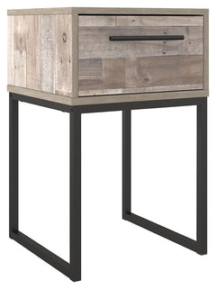 Part beach chic, part urban hip, this nightstand is everything you dreamed of, at a comfortably cool price. The butcher block whitewash finish over replicated pine grain lends a richly relaxed aesthetic that suits your sensibility. A dark pewter-tone draw