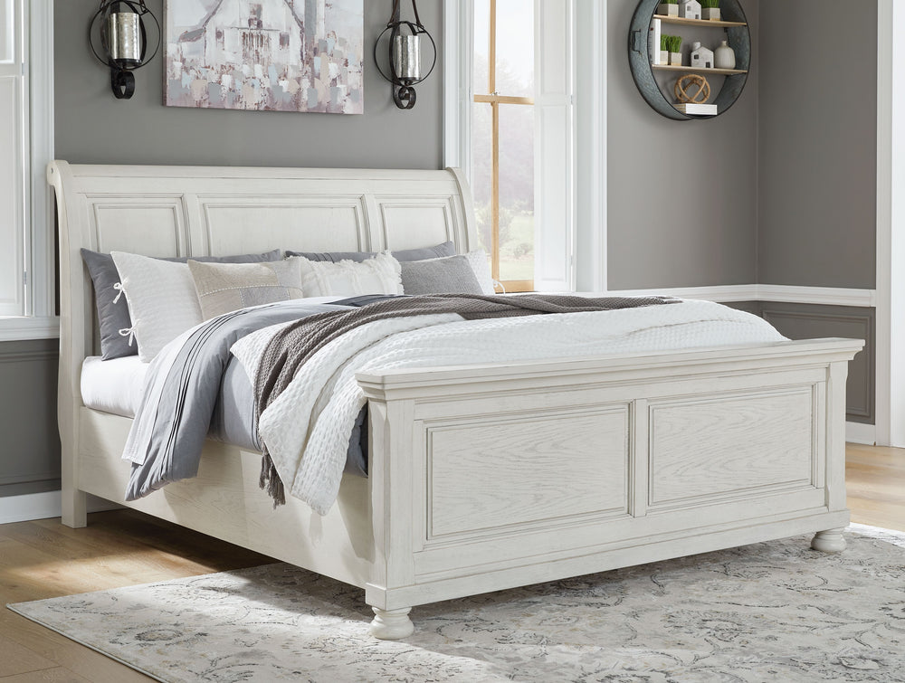 Elegant, timeless furnishings take your bedroom to the next level. Nothing does that better than this king sleigh bed. The antiqued white finish with a wonderful grain texture radiates sophistication, making this the perfect piece to round out the ultimat
