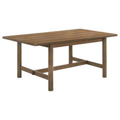 Enjoy the trestle base and inviting style of a modern rectangular dining table. Designed for casual appeal in your kitchen or dining room, it features a natural walnut finish over walnut veneer. The table is a warm and inviting centerpiece for your eat-in