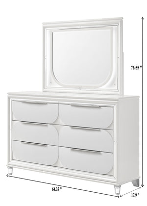  accented with sleek mirrored trim that adds a touch of shine and refinement. The centerpiece is an opulent bed with an oversized he