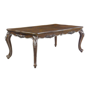 Traditional design with modern accents, the Latisha dining table is the perfect merging of contemporary and classic. The antique oak finish with the hand-brushed silver trim accentuates the elaborate floral moldings that are showcased throughout the legs 