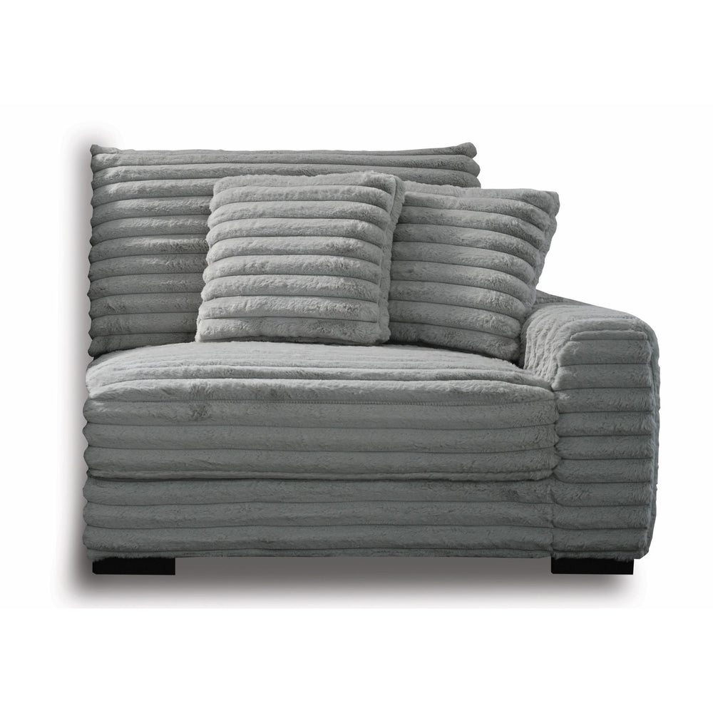 The Embrace Right Arm Facing Chair with 2 Accent Pillows in gray is a sophisticated and comfortable addition to your sectional arrangement. Featuring 100% gray polyester fabric with a fluffy, blanket-like texture, this chair promises ultimate relaxation. 