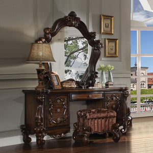 The Versailles vanity desk is the perfect accent to create the style of royalty your bedroom has been needing. This vanity desk crafted in wood with cherry oak finish was inspired by old European design with brown copper metal hardware and intricate wood 