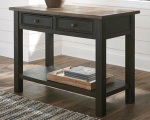  this sofa table is all the talk of todayâ€™s design world. Wood grain shows through the weathered gray-brown top in all of its earthy pleasure. And the framed drawers