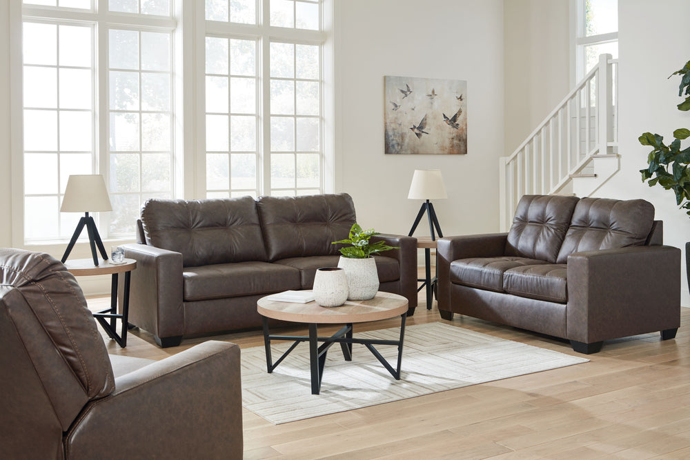 Everyday comfort meets versatile style in this sofa with matching loveseat and recliner. The handsome hue of the goes-with-anything faux leather takes away the stress of styling, expertly pairing with your existing aesthetic. From kicking back on the week