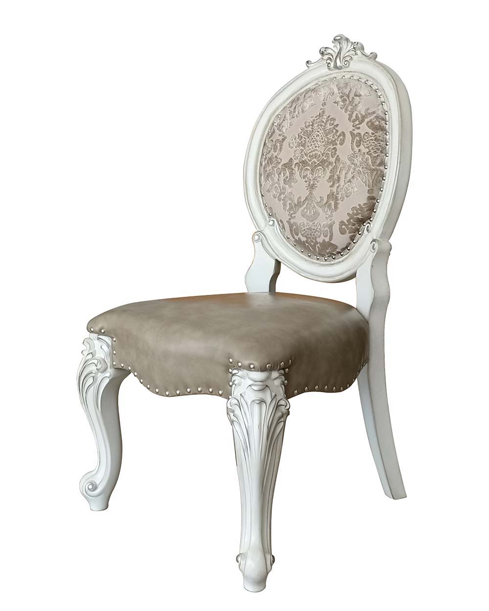 Irresistibly inviting, the Versailles collection displays the unrivaled beauty of the traditional dining. The dining table reflects highly decorative base with oversized scrolled feet, and the upholstered and tapestried chairs with deep button tufted and 