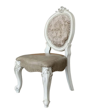 Irresistibly inviting, the Versailles collection displays the unrivaled beauty of the traditional dining. The dining table reflects highly decorative base with oversized scrolled feet, and the upholstered and tapestried chairs with deep button tufted and 