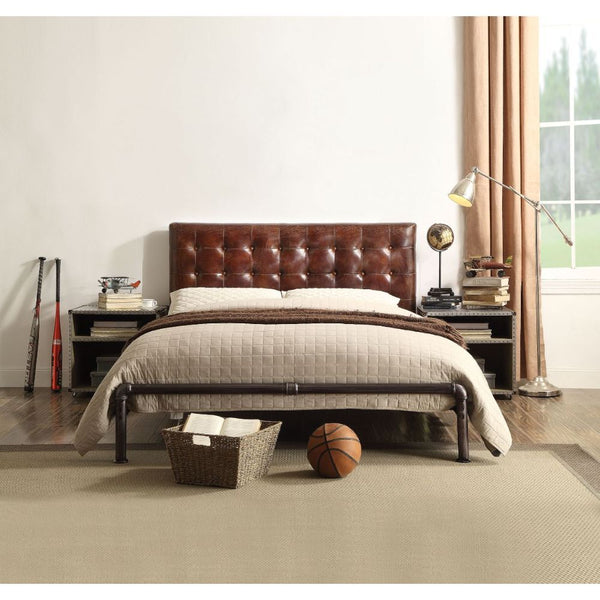 The Brancaster queen bed combines a vintage look with a classical design. This bed features a top grain leather upholstered button tufted head board and sturdy iron metal frame. The elegantly refined detail of this bed gives it a truly unique feel and per