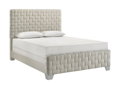This bed is a statement piece that brings a touch of luxury and contemporary design to any bedroom setting. It features an oversized, padded headboard with a detailed basketweave pattern that adds texture and sophistication. The upholstery is crafted with