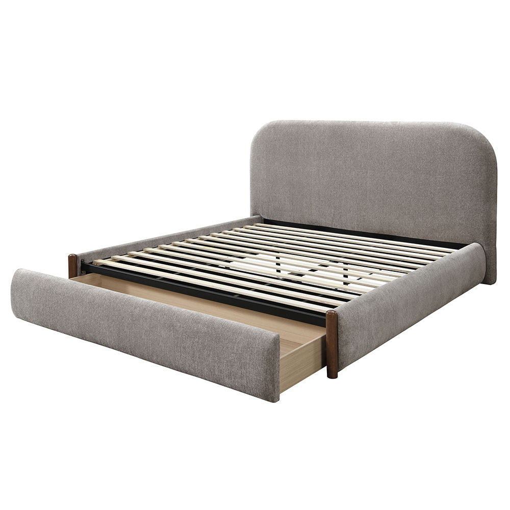 The Orane collection bed wrapped in luxurious gray fabric, combines style and functionality with a low profile footboard and convenient storage. Its full upholstered design offers a sleek, modern look, while the storage footboard provides practicality wit