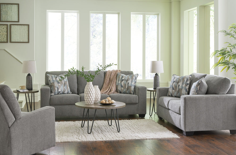 Youâ€™re in for a neat treat with this living room set. Its comfy seats are covered in soft, textural upholstery, and the wide track arms are eager to support your quest for total relaxation. Distressed abstract toss pillows bring a fresh breath of contem