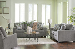 Youâ€™re in for a neat treat with this living room set. Its comfy seats are covered in soft, textural upholstery, and the wide track arms are eager to support your quest for total relaxation. Distressed abstract toss pillows bring a fresh breath of contem
