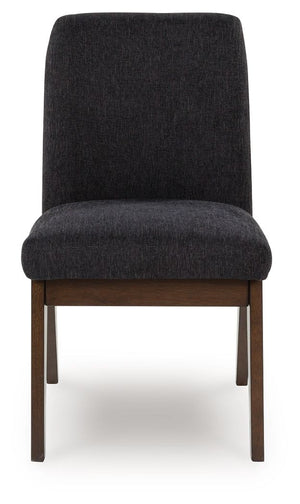  this upholstered bucket dining chair has a rich warm brown finish that beckons everyone to gather around. Black textured upholstery dresses the chair in on