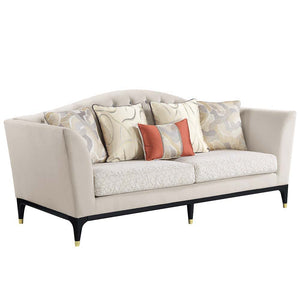 The Tayden camel back sofa brings classic elegance to any living room. Sophisticated curves and crystal-like button tufting adorn the upholstered backrest. For added richness, the seat cushions are upholstered in a geometric fabric. The black base and fee