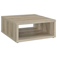 This coffee table combines rustic charm and modern simplicity, crafted from durable engineered wood with a dark pine wood-look finish. Its cube-inspired design features two open sides and a lower shelf for practical storage or display. The wood look lamin