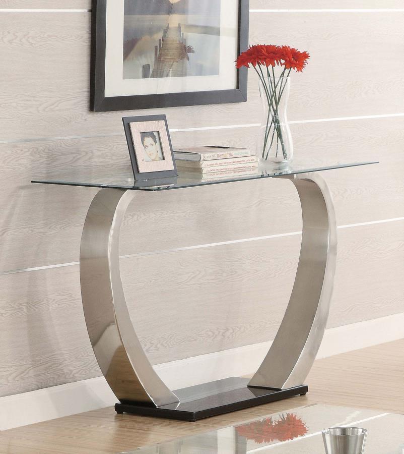 Elevate your living space with this modern rectangular console table, featuring a tempered glass top for enhanced durability and a sleek, stylish finish. The dual curved bases in a brushed satin silver finish add contemporary appeal, while the polished bl
