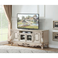Exclusively designed and filled with romantic spirit, the beautiful Gorsedd entertainment center features Queen Anne legs and carved apron and trim, decorated with raised and oversized scrolled moldings in an antique champagne finish. This sophisticated l