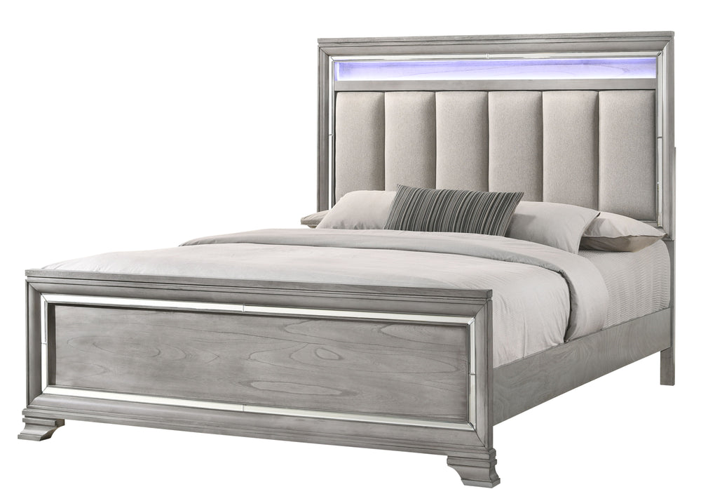 This elegant bedroom suite combines timeless design with contemporary appeal. The soft gray finish offers a modern twist on classic styling, with integrated LED lighting on the tufted headboard adding a luxurious focal point. The collection includes a bed