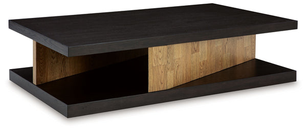 This sculptural coffee table is a perfect blend of contemporary design and relaxed living. Its clean-lined design, contrasting finish and attention-grabbing details take your decor to the next level. The cantilevered top, supported by angled plinths, adds