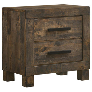 Update a bedroom with strong, stately elegance. Featuring solid hardwood construction, this classic nightstand is a stylish and durable choice. A full matte finish with wire brushed detail gives it a rich, rustic vibe. Wooden handles and thick block feet 