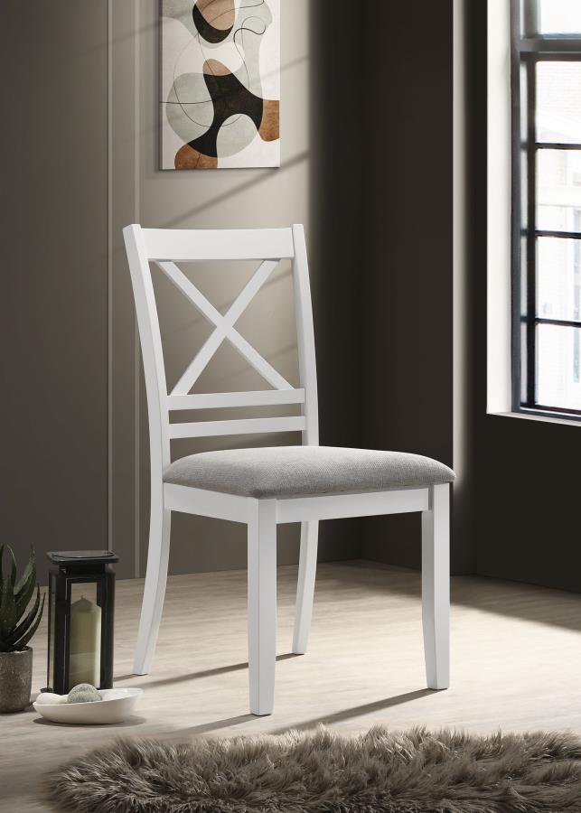 From its neutral palette to its charming details, this modern farmhouse side chair sets the tone in your kitchen or dining room. It shows off a classic stance, with sturdy construction that stands up to daily meals with the family. The chair features a cr