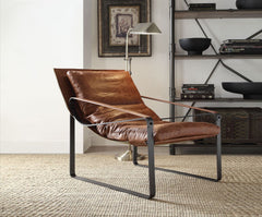Bring home this beautiful Quoba accent chair made of top grain leather. Tucked in the corner of the living room, sidled up next to a side table, or centered on an enclosed porch, this chair is the perfect addition to any room. This graceful durable chair 