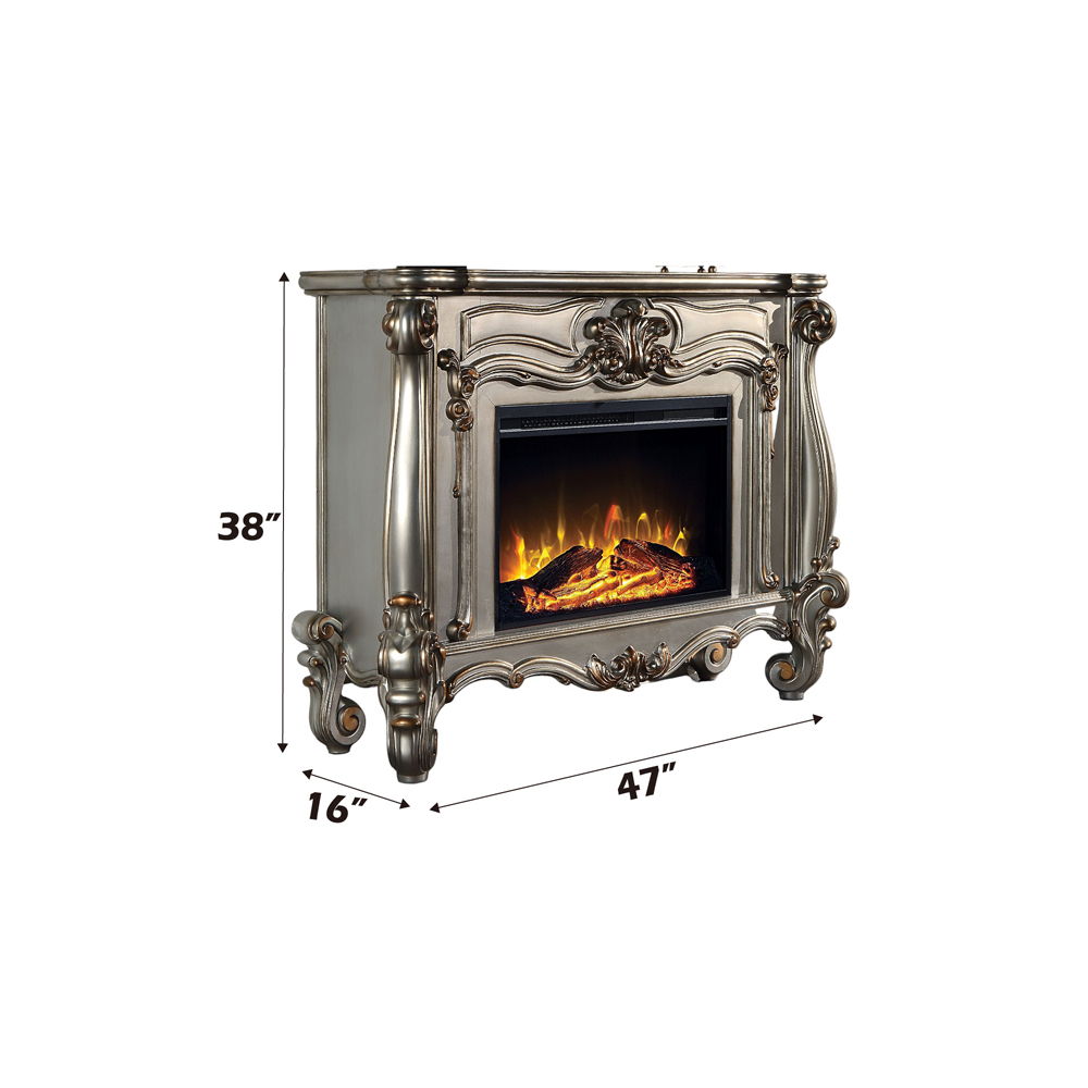 Gather the family around the Versailles fireplace in antique platinum. Traditional details such as scroll legs and carvings make this piece a masterpiece. It comes equipped with fire safety technology that continuously monitors the temperature of the plug