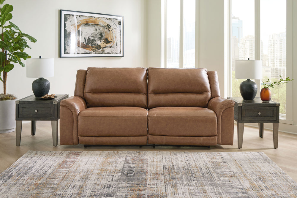 This power reclining set delivers comfort and contemporary style in a big (but not bulky) way. Its supple leather and faux leather upholstery, sumptuous cushioning and one-touch control are sure to take you to your happy place. The sofa-'s power adjustabl