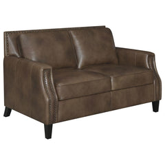 Friends and family will remember your exceptional taste in style when they see this brown sugar loveseat. Upholstered in soft leather grain fabric, this piece is an immediate enhancement to your living area. Back cushions with welted trim make this lovese