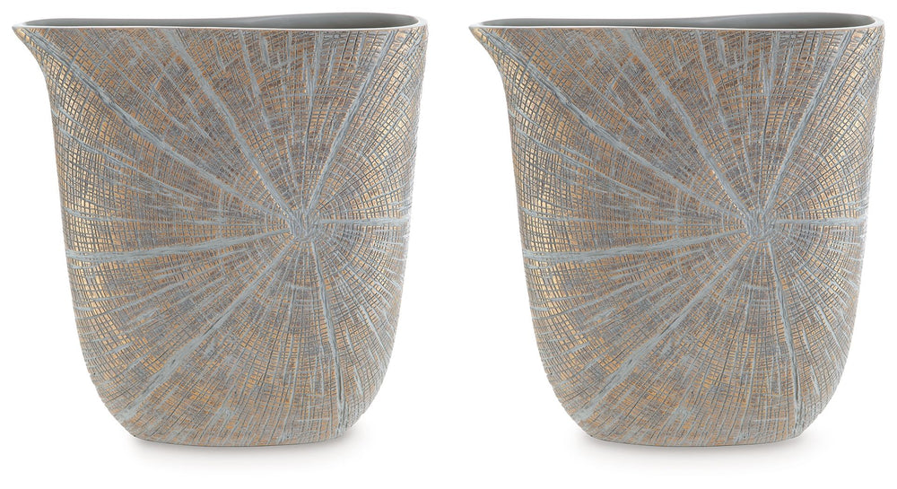 A unique mix of primitive and modern, this vase has an exquisite artisanal appeal. Its wide mouth holds your most bountiful bouquets. The vaseâ€™s intriguing silhouette and starburst pattern capture the eye, complementing a room that craves sophistication
