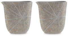 A unique mix of primitive and modern, this vase has an exquisite artisanal appeal. Its wide mouth holds your most bountiful bouquets. The vaseâ€™s intriguing silhouette and starburst pattern capture the eye, complementing a room that craves sophistication
