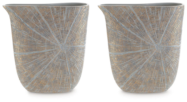 A unique mix of primitive and modern, this vase has an exquisite artisanal appeal. Its wide mouth holds your most bountiful bouquets. The vaseâ€™s intriguing silhouette and starburst pattern capture the eye, complementing a room that craves sophistication