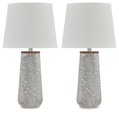 Modern industrial design in a new light. A mixed-media masterpiece, this table lamp provides maximum interest and exceptional versatility with its heavily textured surface. Whether resting on your nightstand or set on a side table, it delivers a unique ae