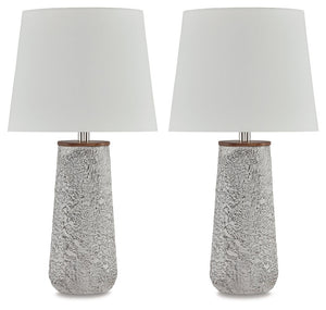 Modern industrial design in a new light. A mixed-media masterpiece, this table lamp provides maximum interest and exceptional versatility with its heavily textured surface. Whether resting on your nightstand or set on a side table, it delivers a unique ae