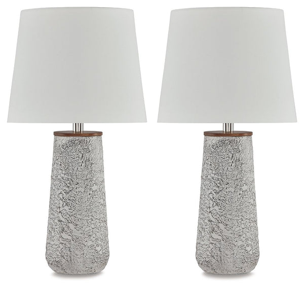 Modern industrial design in a new light. A mixed-media masterpiece, this table lamp provides maximum interest and exceptional versatility with its heavily textured surface. Whether resting on your nightstand or set on a side table, it delivers a unique ae
