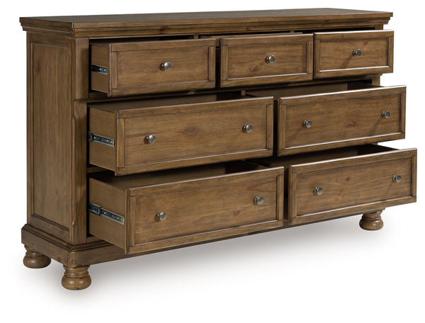  this dresser strikes a comfy pose with a classic sensibility. Its timeless design and chestnut brown wood tone create a welcoming retreat tailored to your laid-back lifestyle. Metal knobs in an aged pewter colo
