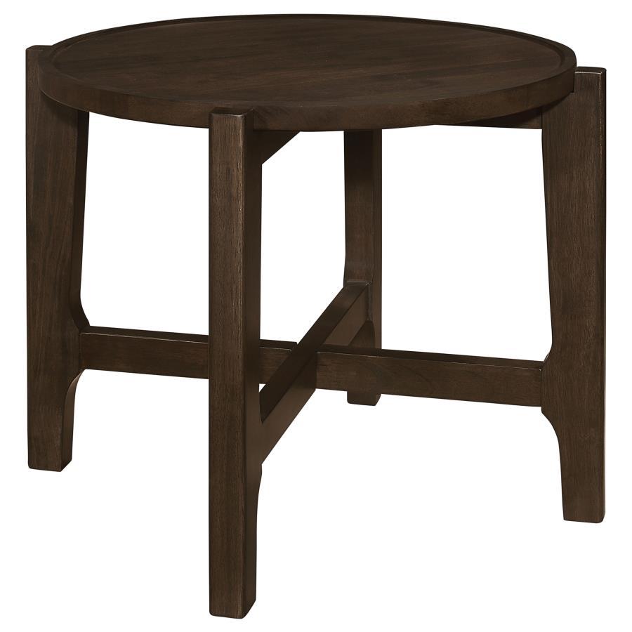 The end table, with its solid wood grandeur and dark brown allure, stands as an intimate alcove in the canvas of the living room. Its round top, bordered by a subtle recess, cradles your evening reads and cherished mementos, a testament to its thoughtful 