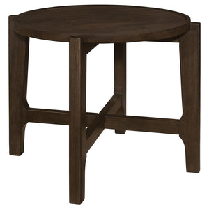 The end table, with its solid wood grandeur and dark brown allure, stands as an intimate alcove in the canvas of the living room. Its round top, bordered by a subtle recess, cradles your evening reads and cherished mementos, a testament to its thoughtful 