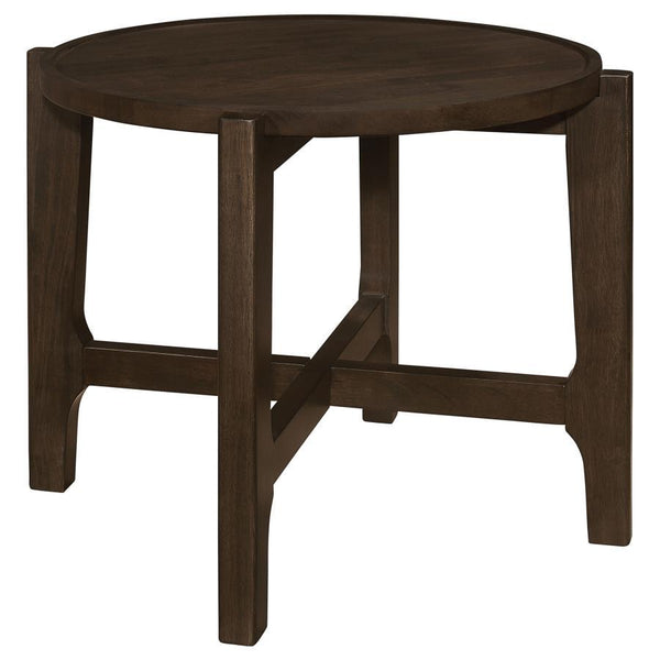 The end table, with its solid wood grandeur and dark brown allure, stands as an intimate alcove in the canvas of the living room. Its round top, bordered by a subtle recess, cradles your evening reads and cherished mementos, a testament to its thoughtful 