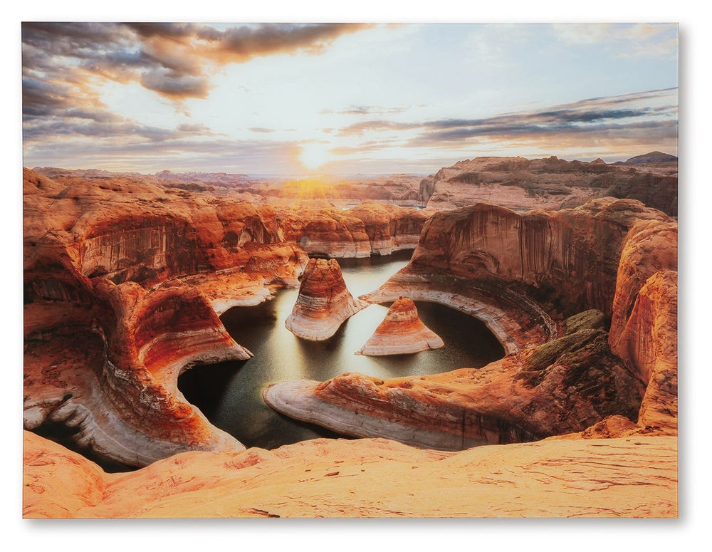 Immerse yourself in the breathtaking beauty of this print on glass. Capturing the serene majesty of sunrise over intricate canyon rock formations and tranquil waters, it brings the awe-inspiring wonders of nature into your home. This stunning piece adds a
