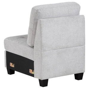  adding length to suit your living room. The chair features tufted cushions and sinuou