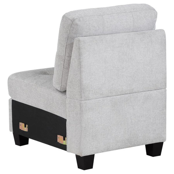  adding length to suit your living room. The chair features tufted cushions and sinuou