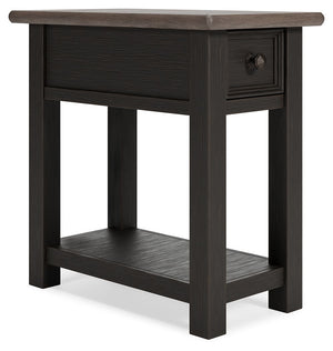 Quality crafted and richly styled, this rectangular chairside end table is sure to charm. Its two-tone aesthetic pairs a weathered grayish brown tabletop with a textured wire brushed base in black. A built-in shelf offers handy display space. And the tabl