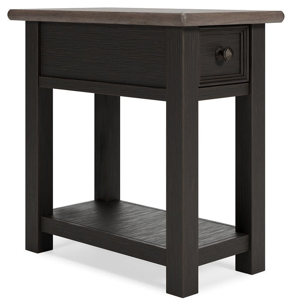 Quality crafted and richly styled, this rectangular chairside end table is sure to charm. Its two-tone aesthetic pairs a weathered grayish brown tabletop with a textured wire brushed base in black. A built-in shelf offers handy display space. And the tabl