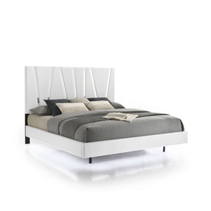 The Europa Panel Bed in white offers a perfect blend of modern elegance and quality craftsmanship. This set includes a panel headboard, footboard, two side rails, and four mattress support slats. Its sleek design is achieved with a majestic headboard, glo