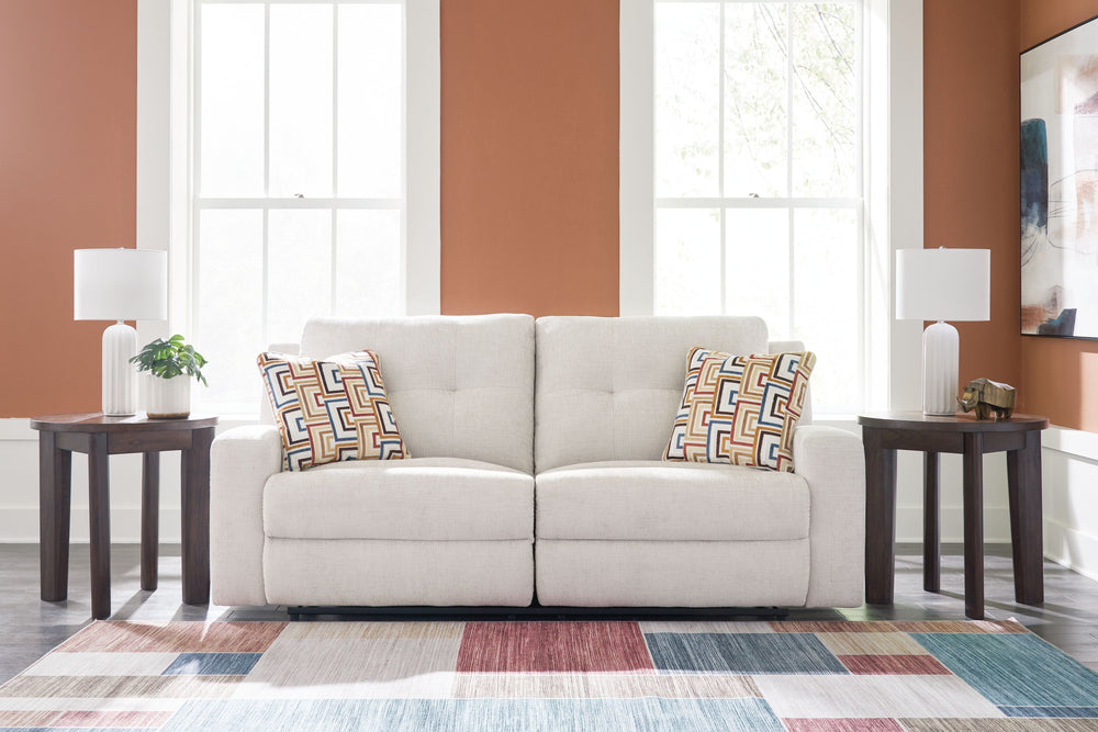 This reclining sofa invites you to a luxuriously soft lounging experience. The chic hue fits right in with contemporary color palettes. A tufted back keeps the look right on trend. Balancing style and function, its pull tab reclining effortlessly takes yo